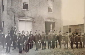 Keeseville firemen and hand pumper, 1880s